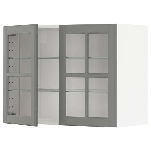 Grey METOD kitchen cabinet with glass doors, featuring adjustable shelves and bevelled edges.