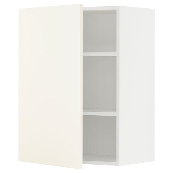 A white METOD kitchen cabinet with two shelves and a hinged door.
