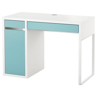 A white MICKE desk with blue accents, featuring adjustable shelves and a cable management system.