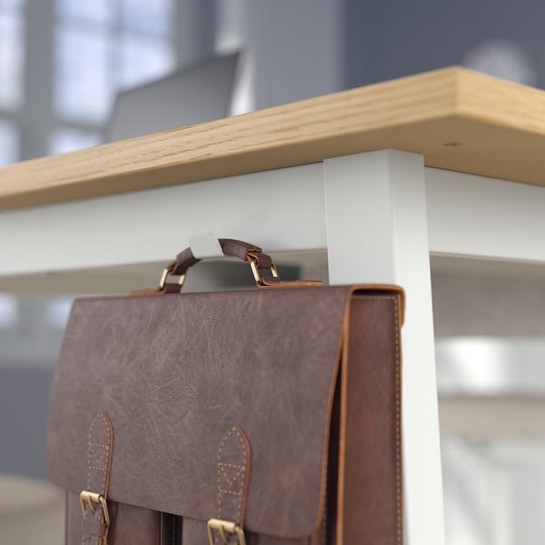 Close-up of high tables footrest, designed for leg support during long meetings.