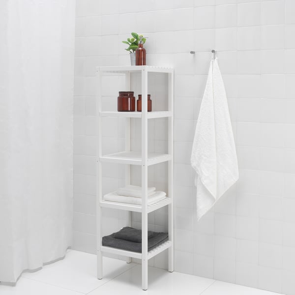 A white shelving unit stores towels, bottles in a bathroom. Easy reach and water-resistant.
