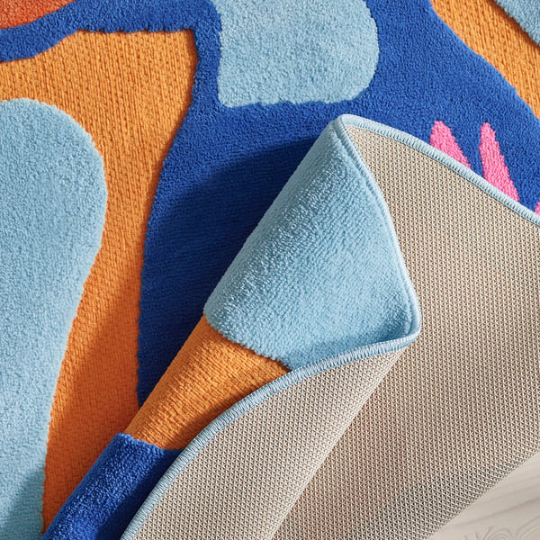 Colourful, plush kids rug with rubber backing, prevents slipping, cosy & safe.