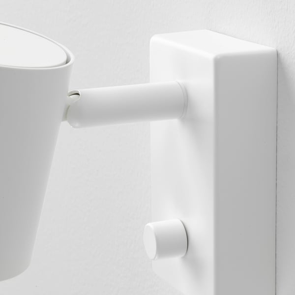 Modern wall lamp with adjustable arm and dimmer.