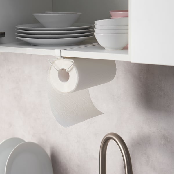 Kitchen shelf with plates, bowls, and paper towels on PÅLYCKE rack.