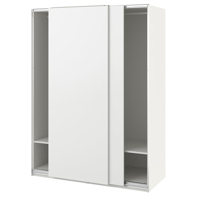 A white ikea PAX wardrobe with sliding doors and adjustable shelves. Minimalist and modern design.