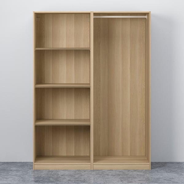 Light wood wardrobe with four empty shelves on left, sliding doors on right.