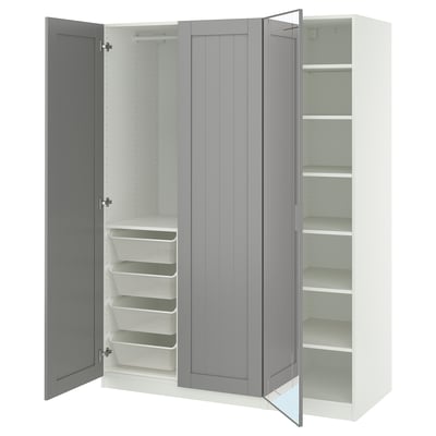 A white and gray ikea PAX wardrobe with open doors, revealing shelves and a mesh basket.