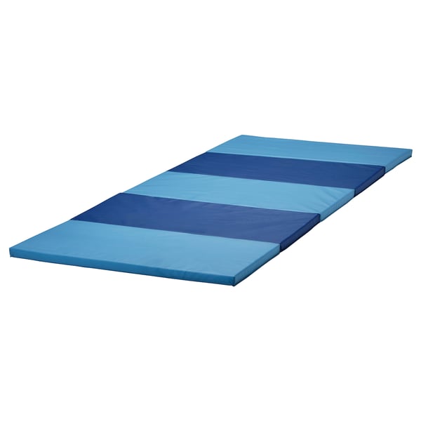 A folded blue and dark blue PLUFSIG gym mat for children. Its rectangular, soft, and designed for practising exercises and coordination.