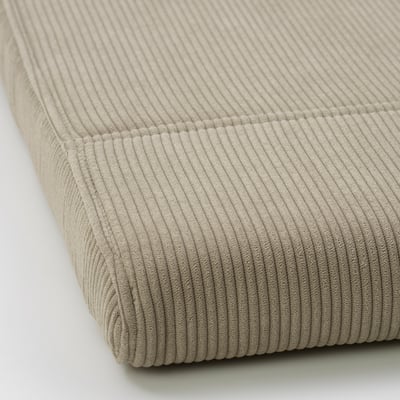 Close-up of plush, textured corduroy footstool cover. Soft, wide-wale, durable.