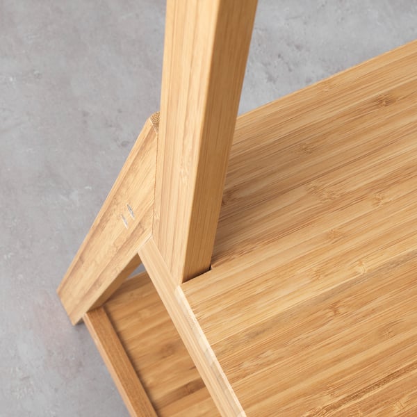 Well-crafted bamboo chair with angled legs, smooth finish, and natural wood texture.