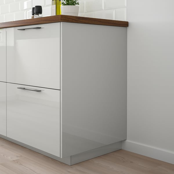 Modern kitchen with white & grey cabinets, glossy finish, silver handles, wooden countertop, maximising storage.