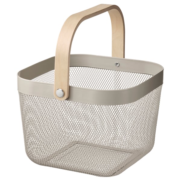 A RISATORP storage basket in beige with a wooden handle. Its rectangular, made from mesh metal and has a simple, functional design.