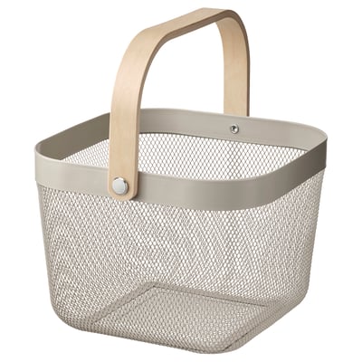 A RISATORP storage basket in beige with a wooden handle. Its rectangular, made from mesh metal and has a simple, functional design.