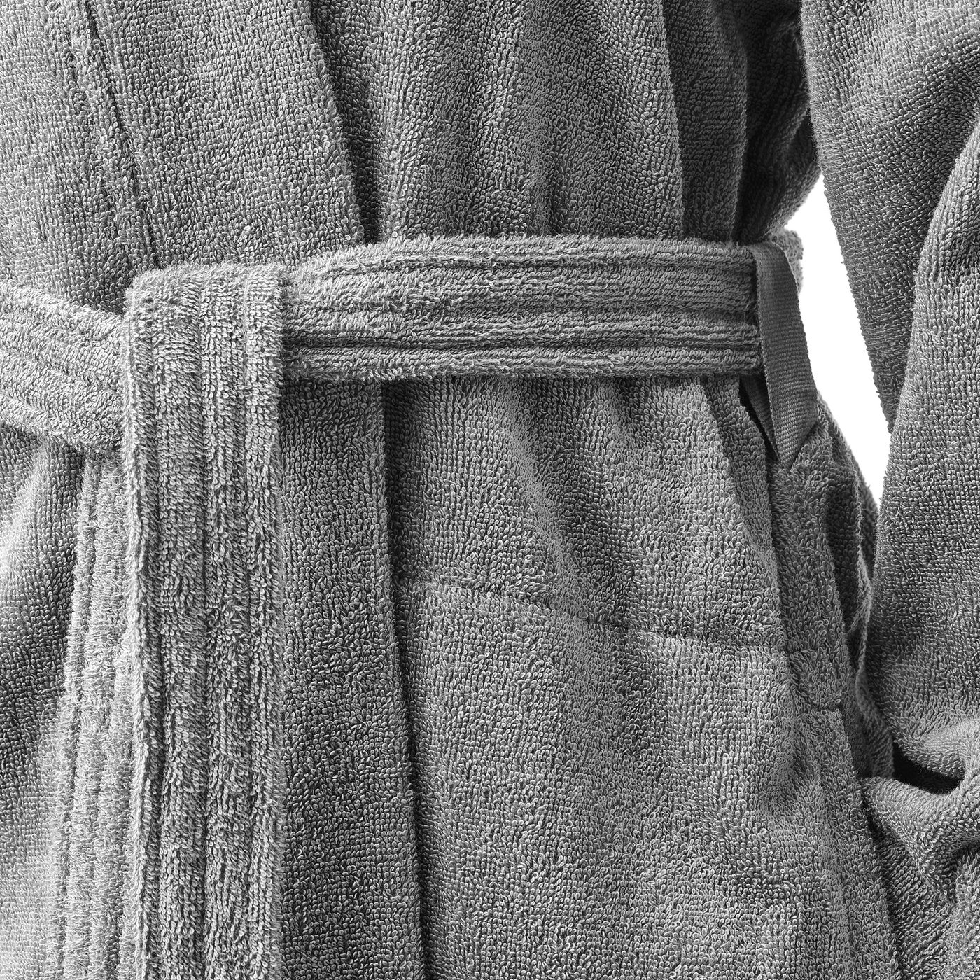 Soft, grey cotton bathrobe with adjustable belt and side pockets, showcasing quality craftsmanship.