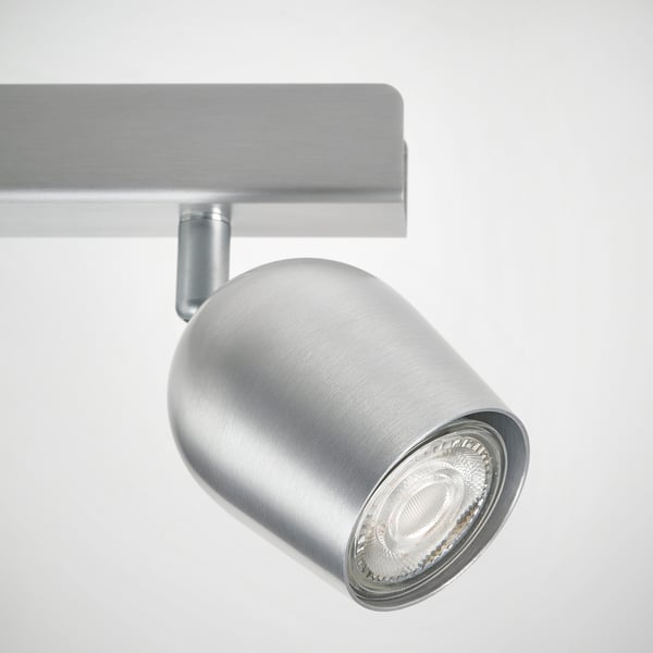 Modern adjustable ceiling spotlight with sleek metallic finish and clear lens. Perfect for directing light.