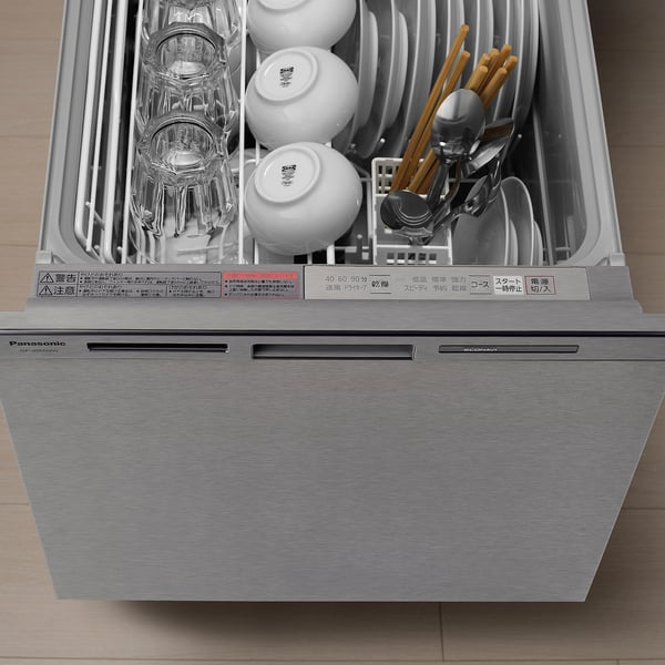 An open dishwasher loaded with bowls, glasses, and utensils. The control panel shows various washing programmes and settings.