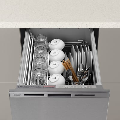 Open stainless steel dishwasher filled with glasses, bowls, utensils, stacked neatly. Branded panasonic.