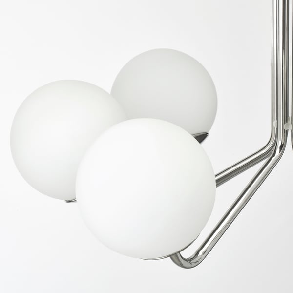 Modern chrome and glass chandelier with three spherical shades. Elegant design, high-quality finish.