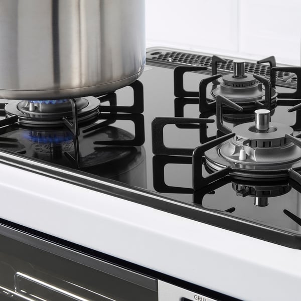 Gas stove with one burner lit.