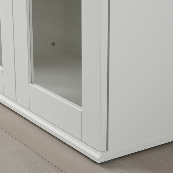 Modern white cabinet with glass doors, sleek design, clean lines, and sturdy build.