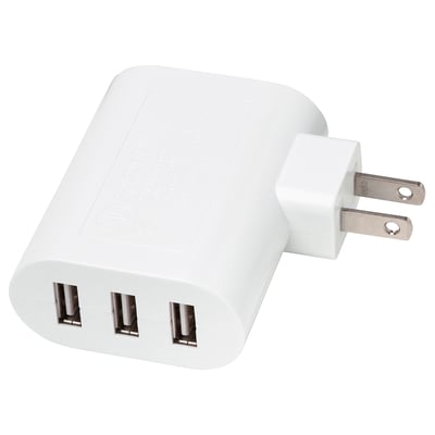 Small white usb charger with 3 ports. Compact, rectangular shape for multiple device charging.