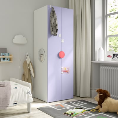 Fascinating kids room featuring SMÅSTAD wardrobe in lavender, standing tall next to a bed with playful decor.