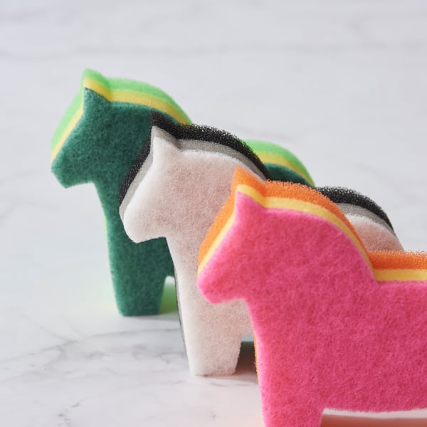 Three colourful horse-shaped sponges, each with soft and coarse sides, arranged on a white surface.