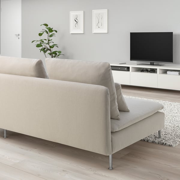 Modern living room with beige SÖDERHAMN sofa, tv, and decor. Sofa is compact, fits well with large plant and tv stand.