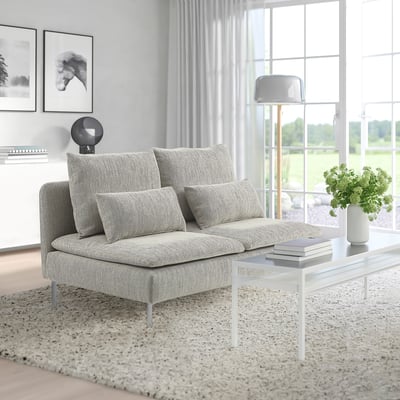 Modern minimalist living room with a SÖDERHAMN compact grey sofa, white coffee table, large window, curtain, and wall art.