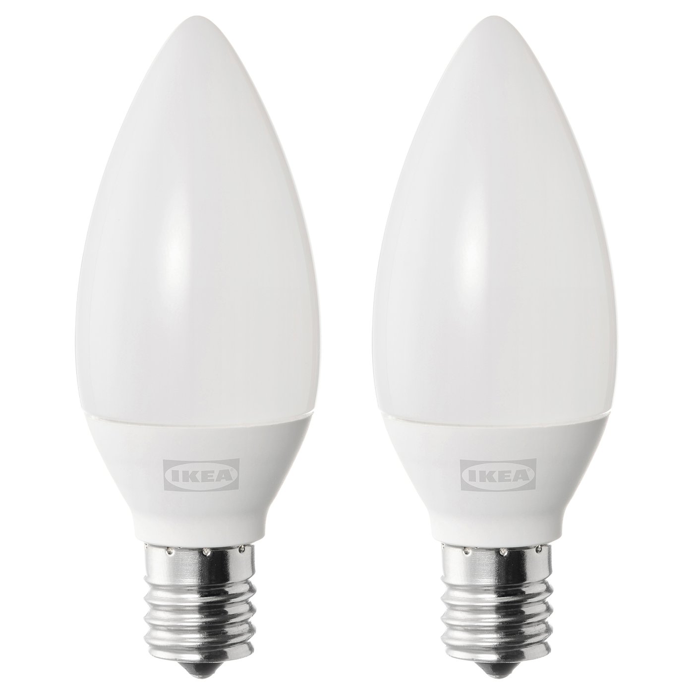 Two white ikea SOLHETTA led light bulbs with e12 base, frosted covers, standing upright.