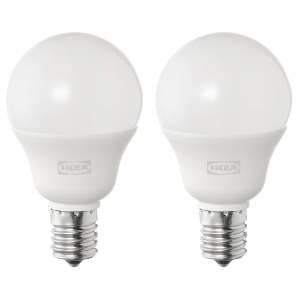 Two ikea SOLHETTA led bulbs, white, spherical shape, stand upright, metallic base, frosted dome cover.