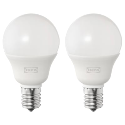 Two ikea SOLHETTA led bulbs, white, spherical shape, stand upright, metallic base, frosted dome cover.