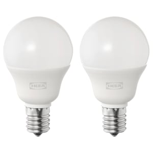 Two ikea SOLHETTA led bulbs, white, spherical shape, stand upright, metallic base, frosted dome cover.