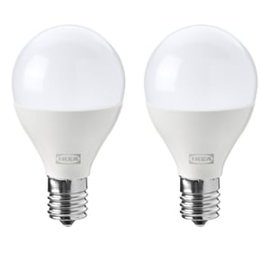 Two identical round white IKEA led light bulbs with a metallic base, labelled SOLHETTA.