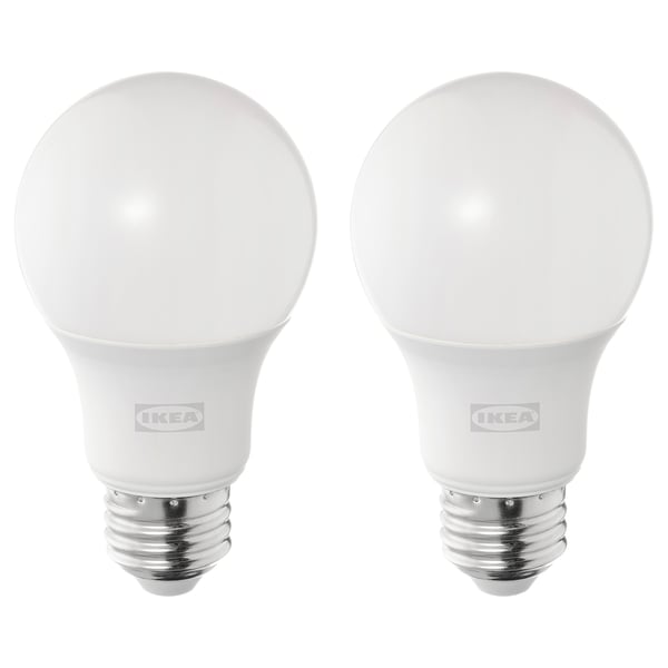 Two ikea led light bulbs, white, spherical shape, warm-white light, durable plastic and metal base.
