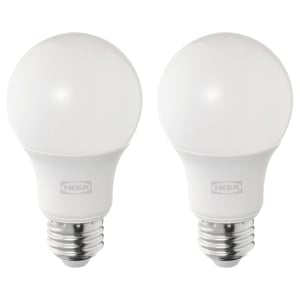 Two ikea led light bulbs, white, spherical shape, warm-white light, durable plastic and metal base.