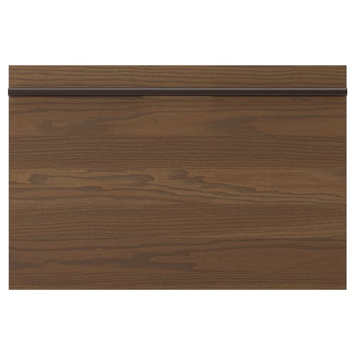 A dark brown wooden drawer front with a linear grain pattern and a straight handle.
