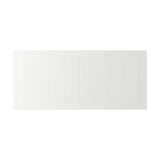 White wooden panel, rectangular with vertical grooves, smooth clean finish.