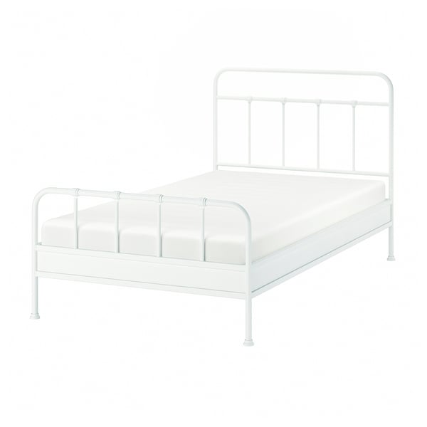 Depicts a white STJÄRNÖ metal bed frame with a curved headboard and footboard, featuring classic with modern details.