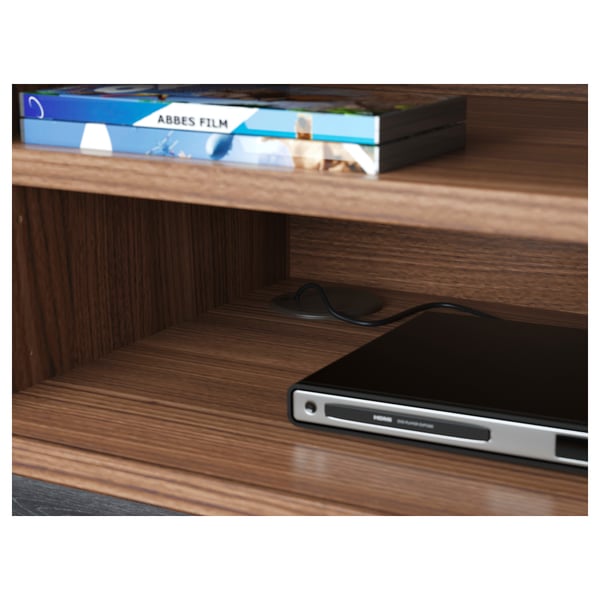 Wooden tv stand with adjustable shelves, showing electronic device and cables managed through a hole.
