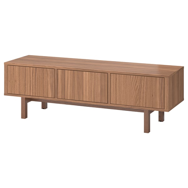 A STOCKHOLM tv bench made of walnut veneer with a rectangular shape and mid-century modern design. It three doors and solid ash legs.