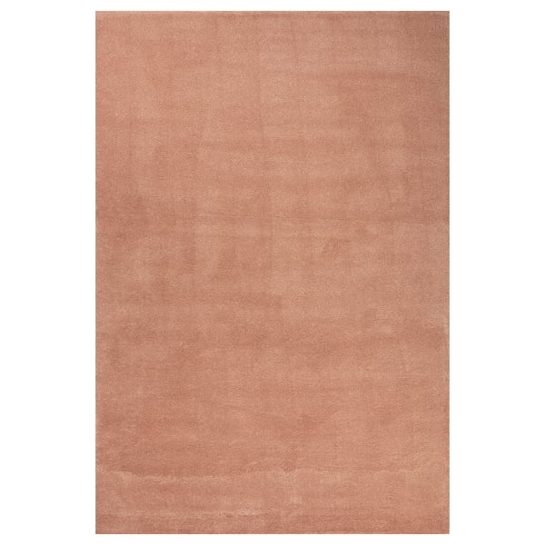 A beige STOENSE rug with a soft, dense pile and subtle sheen. Its rectangular and made of polypropylene and synthetic rubber.