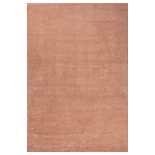A beige STOENSE rug with a soft, dense pile and subtle sheen. Its rectangular and made of polypropylene and synthetic rubber.