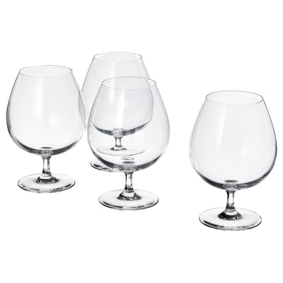 Four clear, crystalline wine glasses with long stems and broad bowls, arranged in a triangular formation on a white background.