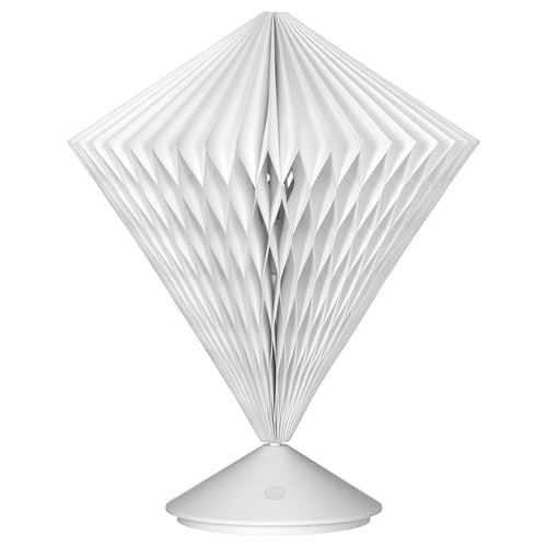 STRÅLA lamp, white, diamond-shaped, pleated paper shade, battery-operated base, soft warm glow.