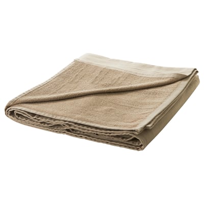 Folded beige cotton duvet. Neatly arranged with simple design.