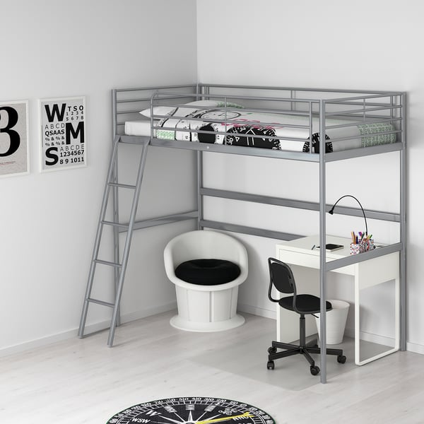 SVÄRTA silver loft bed with desk, chair, and ladder, maximising small room space.