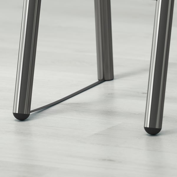Four sleek, metallic legs supporting a loft bed frame. Part of SVÄRTA design, ideal for maximising floor space.