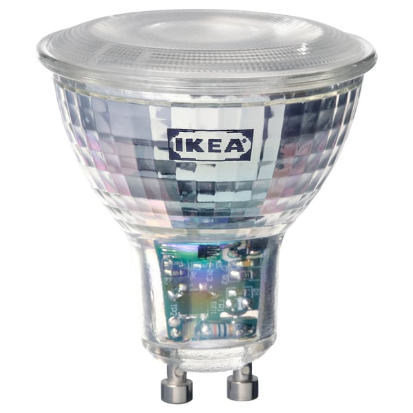 Ikea TRÅDFRI smart led bulb, transparent, hexagonal facets, metallic base, modern design.