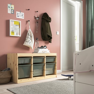TROFAST: wooden storage, large size, various compartments, mesh boxes. Holds jackets and books, near door.